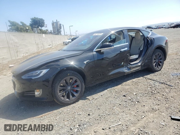 2019 Tesla Model S 100D with VIN 5YJSA1E42KF331240, listed as a Copart auction lot 54713975 with 43,940 mi miles and Salvage title. Bid and sale history available at DreamBid. Image 1.