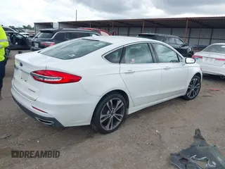 2020 Ford Fusion Titanium с VIN 3FA6P0D98LR151810, выставлен на аукционе IAAI как лот 42590902 с пробегом 76 624 миль миль и . История ставок и продаж доступна на DreamBid. Изображение 4.