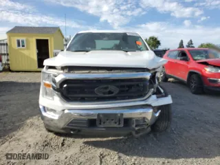 2021 Ford F-150 XL with VIN 1FTFW1E83MFB80686, listed as a Copart auction lot 52386125 with 156,582 mi miles and Salvage Title. Bid and sale history available at carsss.com. Image 5.