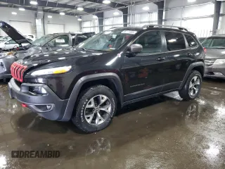 2014 Jeep Cherokee Trailhawk z VIN 1C4PJMBSXEW187981, wystawiony jako Copart lot #56711885 z przebiegiem 157 317 mil mil oraz Szkoda całkowita • Salvage title. Historia ofert i sprzedaży dostępna na DreamBid. Obrazek 1.
