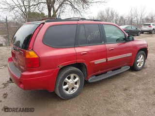 2003 GMC Envoy SLE with VIN 1GKDT13S932334925, listed as a IAAI auction lot 42071477 with 232,935 mi miles. Bid and sale history available at carsss.com. Image 4.