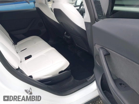 2023 Tesla Model Y Long Range z VIN 7SAYGAEEXPF647352, wystawiony jako IAAI lot #41955933 z przebiegiem Nie podano mil oraz . Historia ofert i sprzedaży dostępna na DreamBid. Obrazek 8.