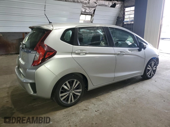 2015 Honda Fit EX-L with VIN 3HGGK5H86FM754172, listed as a Copart auction lot 60870975 with 74,377 mi miles and Salvage title. Bid and sale history available at DreamBid. Image 3.