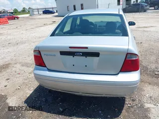 2007 Ford Focus S z VIN 1FAFP34N57W109953, wystawiony jako IAAI lot #42225399 z przebiegiem Nie podano mil oraz . Historia ofert i sprzedaży dostępna na DreamBid. Obrazek 16.