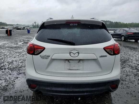 2016 Mazda CX-5 Touring z VIN JM3KE2CY5G0849288, wystawiony jako Copart lot #54594545 z przebiegiem 90 882 mil mil oraz Szkoda całkowita • Salvage title. Historia ofert i sprzedaży dostępna na DreamBid. Obrazek 6.