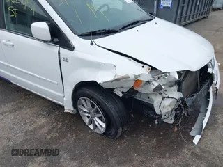 2014 Dodge Grand Caravan SXT with VIN 2C4RDGCG6ER361842, listed as a IAAI auction lot 41827951 with 100,845 mi miles and . Bid and sale history available at DreamBid. Image 6.