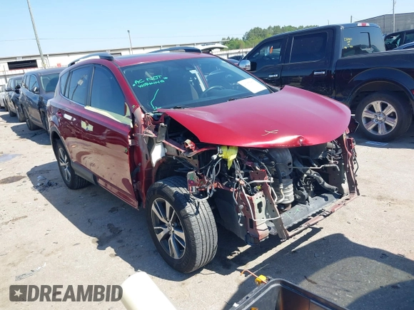 2018 Toyota RAV4 XLE with VIN 2T3WFREV8JW425464, listed as a IAAI auction lot 41977877 with 142,265 mi miles and . Bid and sale history available at carsss.com. Image 1.