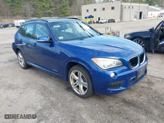2014 BMW X1 xDrive28i with VIN WBAVL1C58EVY24491, listed as a IAAI auction lot 42022672 with 115,123 mi miles. Bid and sale history available at carsss.com. Image 1.