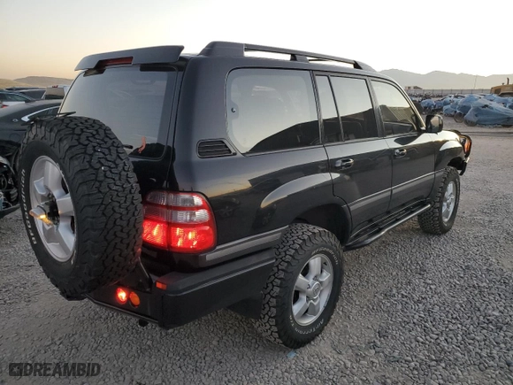 2003 Toyota Land Cruiser with VIN JTEHT05J132049479, listed as a Copart auction lot 74533464 with 218,413 mi miles and Salvage Title. Bid and sale history available at carsss.com. Image 3.
