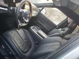 2023 Rivian R1S Adventure with VIN 7PDSGABAXPN008547, listed as a Copart auction lot 89061955 with 24,454 mi miles and Salvage Title. Bid and sale history available at carsss.com. Image 7.