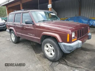 2000 Jeep Cherokee with VIN 1J4FF48SXYL198290, listed as a Copart auction lot 66026705 with 201,409 mi miles and Clean title. Bid and sale history available at DreamBid. Image 4.