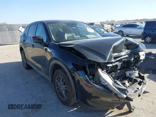 2020 Mazda CX-5 Touring with VIN JM3KFACM0L0780265, listed as a IAAI auction lot 41825873 with 151,888 mi miles. Bid and sale history available at carsss.com. Image 1.