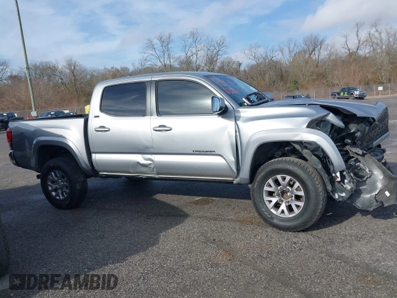 2018 Toyota Tacoma SR5 with VIN 5TFAZ5CN6JX057889, listed as a IAAI auction lot 41449604 with 114,888 mi miles and . Bid and sale history available at DreamBid. Image 13.