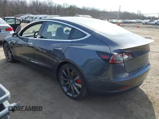 2018 Tesla Model 3 Long Range Battery with VIN 5YJ3E1EB5JF063077, listed as a IAAI auction lot 41773551 with 99,477 mi miles and . Bid and sale history available at DreamBid. Image 3.