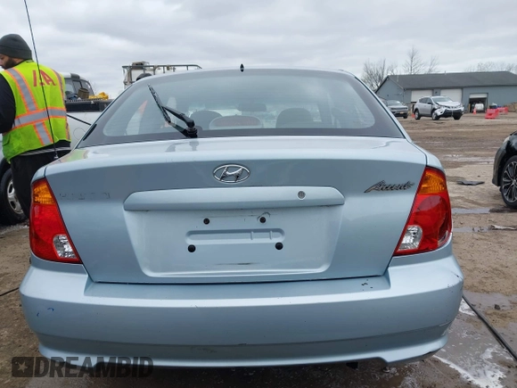 2003 Hyundai Accent GL with VIN KMHCG35C23U264360, listed as a IAAI auction lot 42033316 with 100,991 mi miles. Bid and sale history available at carsss.com. Image 16.
