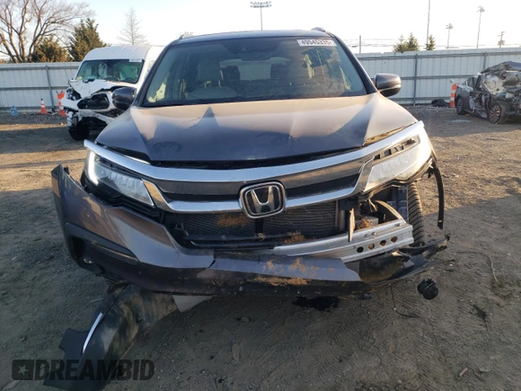 2020 Honda Pilot Touring 8-Passenger with VIN 5FNYF6H92LB031005, listed as a Copart auction lot 49545335 with 59,789 mi miles and Salvage Title. Bid and sale history available at DreamBid. Image 5.