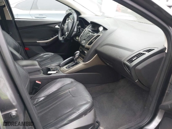2012 Ford Focus SEL with VIN 1FAHP3H23CL348356, listed as a IAAI auction lot 42041001 with 174,510 mi miles. Bid and sale history available at carsss.com. Image 5.