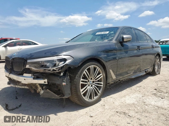2019 BMW 5 Series M550i xDrive with VIN WBAJB9C51KB287797, listed as a Copart auction lot 65382465 with 61,459 mi miles and Salvage title. Bid and sale history available at DreamBid. Image 1.