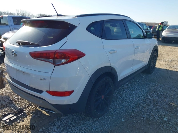 2017 Hyundai Tucson Value with VIN KM8J33A28HU533047, listed as a IAAI auction lot 41853087 with 74,238 mi miles. Bid and sale history available at carsss.com. Image 4.
