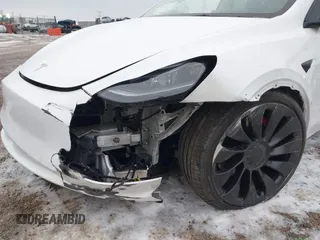 2021 Tesla Model Y Performance with VIN 5YJYGDEF6MF261711, listed as a IAAI auction lot 41176208 with 25,687 mi miles and . Bid and sale history available at DreamBid. Image 6.