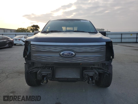2023 Ford F-150 Lightning Pro with VIN 1FTVW1EV1PWG16263, listed as a Copart auction lot 54439535 with 12,023 mi miles and Salvage Title. Bid and sale history available at DreamBid. Image 5.