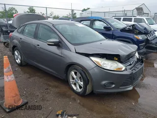 2013 Ford Focus SE z VIN 1FADP3F21DL259033, wystawiony jako IAAI lot #42296905 z przebiegiem 86 832 mil mil oraz . Historia ofert i sprzedaży dostępna na DreamBid. Obrazek 1.