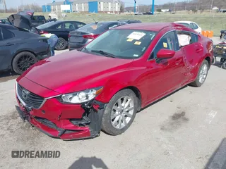 2016 Mazda 6 i Sport with VIN JM1GJ1U53G1409105, listed as a IAAI auction lot 41828135 with 136,812 mi miles and . Bid and sale history available at DreamBid. Image 2.