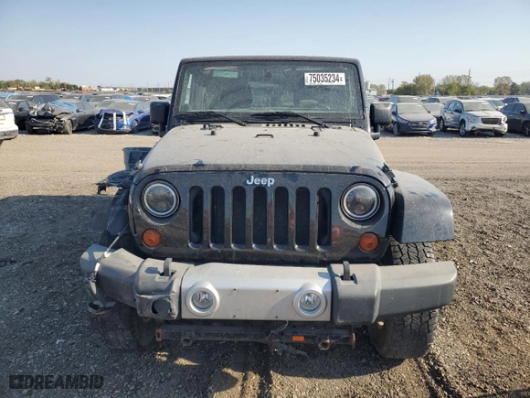 2011 Jeep Wrangler Unlimited Sahara with VIN 1J4BA5H10BL634002, listed as a Copart auction lot 75035234 with 139,182 mi miles and Salvage Title. Bid and sale history available at carsss.com. Image 5.