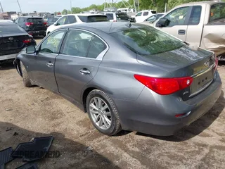 2015 Infiniti Q50 Premium z VIN JN1BV7AR1FM398047, wystawiony jako IAAI lot #42203862 z przebiegiem 104 002 mil mil oraz . Historia ofert i sprzedaży dostępna na DreamBid. Obrazek 3.