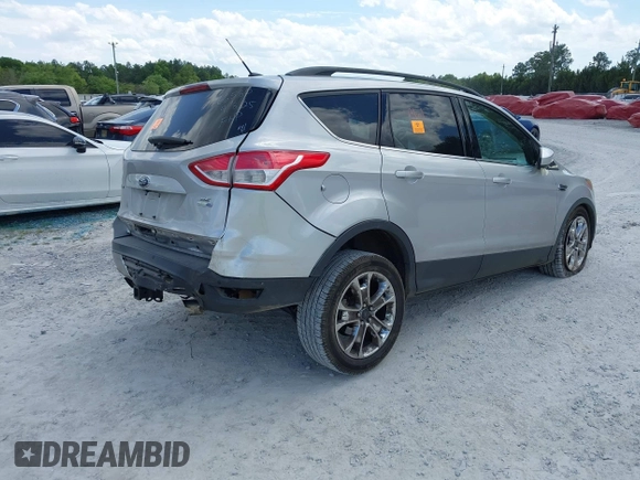 2016 Ford Escape SE with VIN 1FMCU9G92GUC28879, listed as a IAAI auction lot 42021065 with 99,184 mi miles. Bid and sale history available at carsss.com. Image 4.