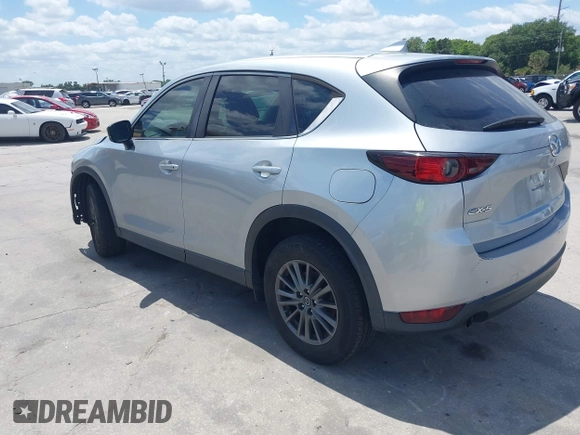 2017 Mazda CX-5 Sport with VIN JM3KFABLXH0135560, listed as a IAAI auction lot 42062016 with 153,416 mi miles. Bid and sale history available at carsss.com. Image 3.