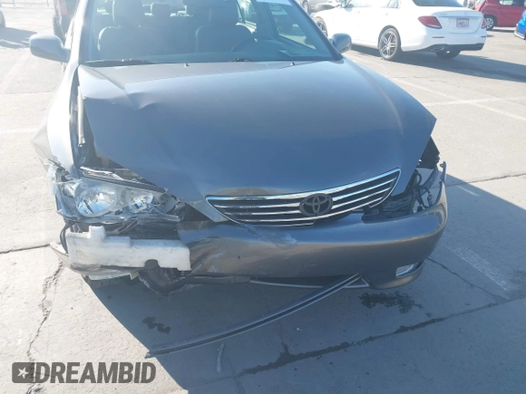 2005 Toyota Camry LE with VIN 4T1BF30K55U619313, listed as a IAAI auction lot 41854001 with 89,982 mi miles and . Bid and sale history available at DreamBid. Image 6.