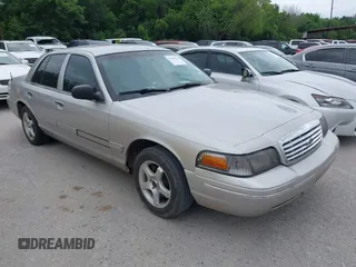 2005 Ford Crown Victoria LX z VIN 2FAFP74W35X159087, wystawiony jako IAAI lot #42101328 z przebiegiem 222 145 mil mil oraz . Historia ofert i sprzedaży dostępna na DreamBid. Obrazek 1.