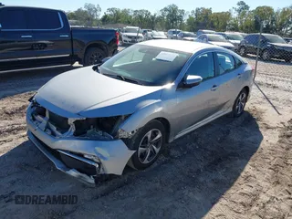 2020 Honda Civic LX with VIN 19XFC2F62LE009433, listed as a IAAI auction lot 40963670 with 117,865 mi miles and . Bid and sale history available at DreamBid. Image 17.