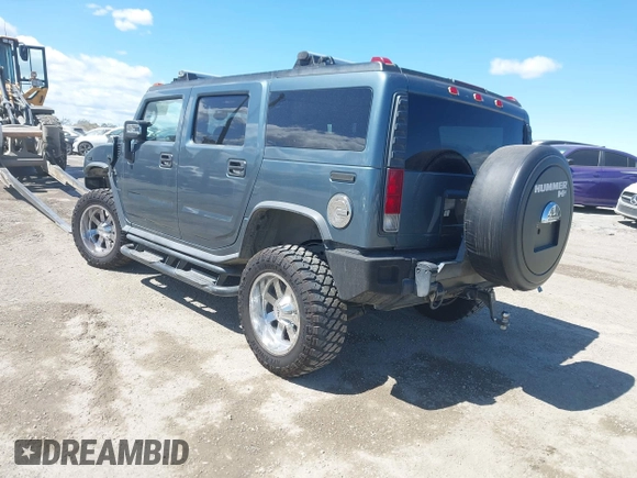 2005 Hummer H2 SUV with VIN 5GRGN23U35H105620, listed as a IAAI auction lot 41912574 with 232,938 mi miles. Bid and sale history available at carsss.com. Image 3.