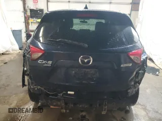 2016 Mazda CX-5 Touring z VIN JM3KE4CY4G0838908, wystawiony jako Copart lot #57961625 z przebiegiem 178 615 mil mil oraz Szkoda całkowita • Salvage title. Historia ofert i sprzedaży dostępna na DreamBid. Obrazek 6.