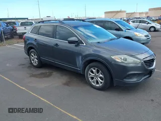 2014 Mazda CX-9 Sport with VIN JM3TB2BA2E0433374, listed as a IAAI auction lot 42174620 with 153,803 mi miles and . Bid and sale history available at DreamBid. Image 1.