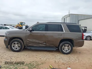 2015 Chevrolet Tahoe LT z VIN 1GNSCBKC2FR685780, wystawiony jako IAAI lot #42354130 z przebiegiem 101 617 mil mil oraz . Historia ofert i sprzedaży dostępna na DreamBid. Obrazek 14.