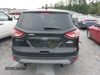 2014 Ford Escape SE with VIN 1FMCU0GX9EUB21853, listed as a IAAI auction lot 40313063 with 106,687 mi miles. Bid and sale history available at carsss.com. Image 16.