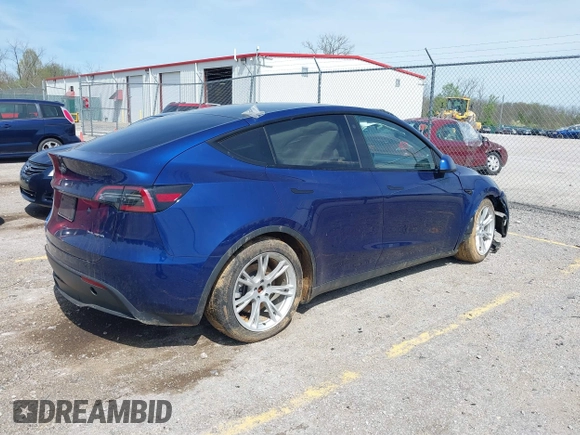 2023 Tesla Model Y Long Range with VIN 7SAYGDEE7PF702051, listed as a IAAI auction lot 42074182 with 50,473 mi miles and . Bid and sale history available at DreamBid. Image 4.