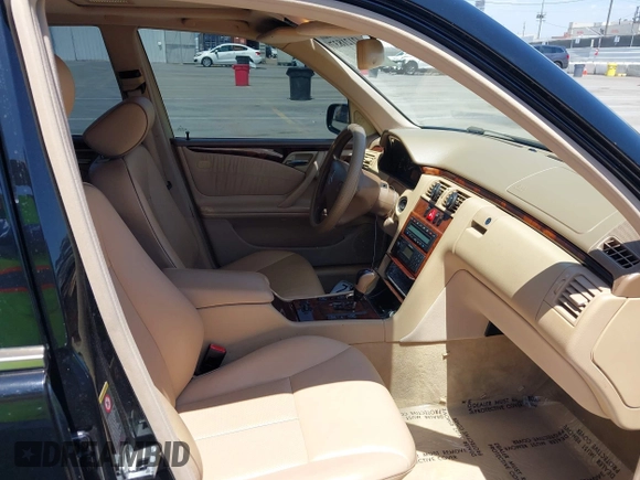 2002 Mercedes-Benz E-Class with VIN WDBJF65J62B404868, listed as a IAAI auction lot 42121837 with 107,415 mi miles. Bid and sale history available at carsss.com. Image 5.