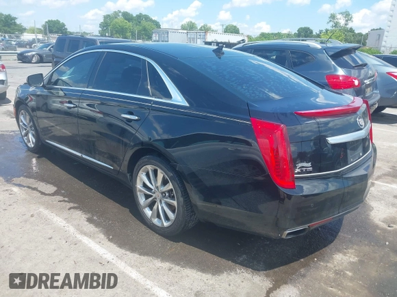 2013 Cadillac XTS Luxury z VIN 2G61P5S37D9101989, wystawiony jako IAAI lot #42242641 z przebiegiem 243 006 mil mil oraz . Historia ofert i sprzedaży dostępna na DreamBid. Obrazek 3.