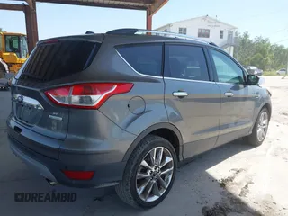 2014 Ford Escape SE z VIN 1FMCU0G97EUE34174, wystawiony jako IAAI lot #42274846 z przebiegiem 121 801 mil mil oraz . Historia ofert i sprzedaży dostępna na DreamBid. Obrazek 4.