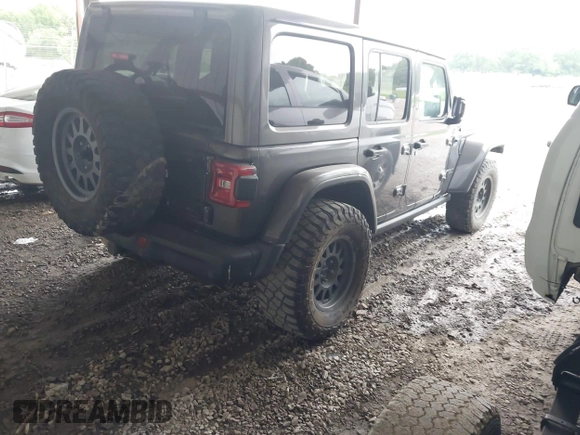 2021 Jeep Wrangler Unlimited Rubicon with VIN 1C4JJXFM6MW538774, listed as a IAAI auction lot 42368651 with 49,490 mi miles and . Bid and sale history available at DreamBid. Image 4.