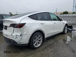 2023 Tesla Model Y Long Range z VIN 7SAYGDEE4PF797653, wystawiony jako Copart lot #58668985 z przebiegiem 35 520 mil mil oraz Szkody całkowita. Historia ofert i sprzedaży dostępna na DreamBid. Obrazek 3.