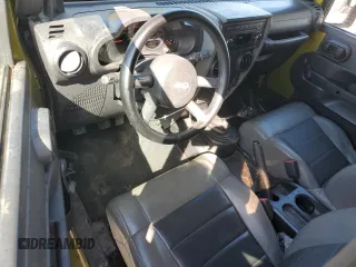2008 Jeep Wrangler X with VIN 1J4FA24168L609202, listed as a Copart auction lot 52901975 with 165,083 mi miles and Salvage Title. Bid and sale history available at DreamBid. Image 8.