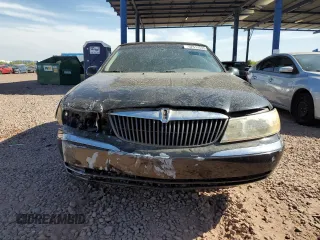2001 Lincoln Continental with VIN 1LNHM97V61Y604213, listed as a Copart auction lot 52517535 with 112,391 mi miles and Salvage Title. Bid and sale history available at DreamBid. Image 5.