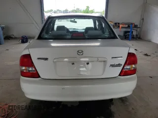 1999 Mazda Protege DX z VIN JM1BJ2224X0173126, wystawiony jako Copart lot #57389245 z przebiegiem 155 534 mil mil oraz Szkoda całkowita • Salvage title. Historia ofert i sprzedaży dostępna na DreamBid. Obrazek 6.