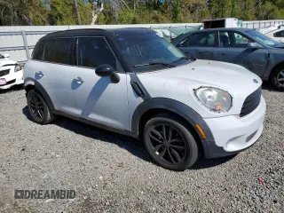2011 MINI Countryman with VIN WMWZB3C56BWM00040, listed as a Copart auction lot 48660435 with 146,607 mi miles and Salvage title. Bid and sale history available at DreamBid. Image 4.