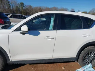 2020 Mazda CX-5 Touring with VIN JM3KFBCM0L0828207, listed as a IAAI auction lot 41305801 with 56,500 mi miles and . Bid and sale history available at DreamBid. Image 14.